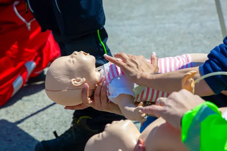 hands-performing-cpr-on-infant