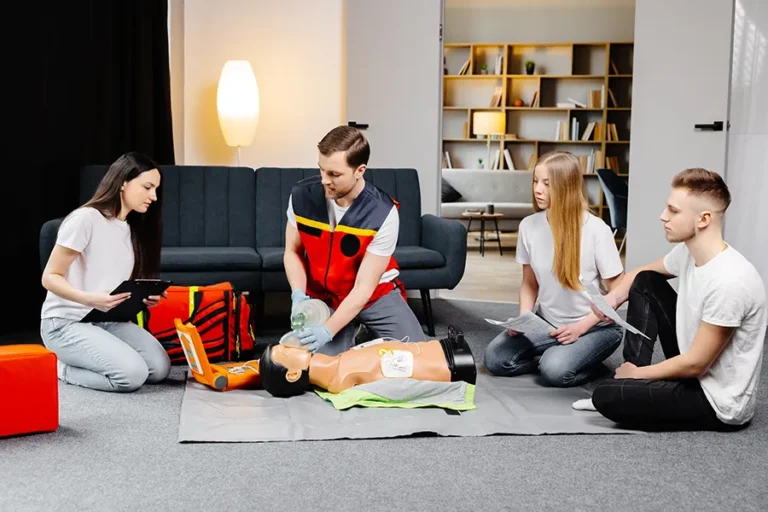 adults-practice-first-aid-on-mannequin