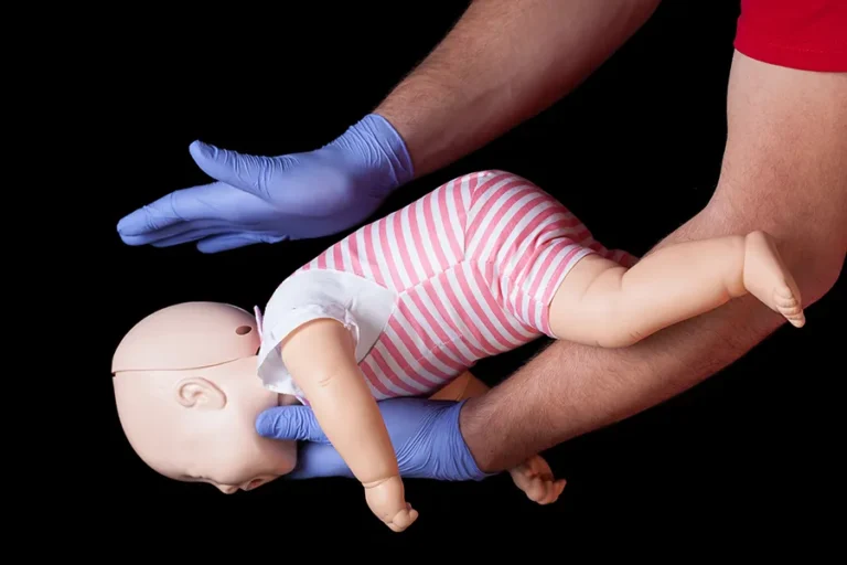 medical-professional-demonstrating-infant-cpr
