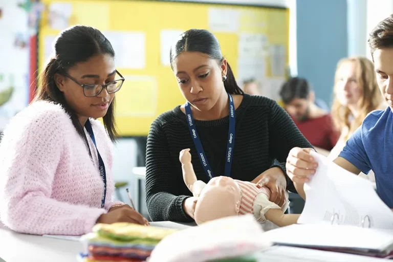 young-adults-practicing-first-aid-in-a-classroom